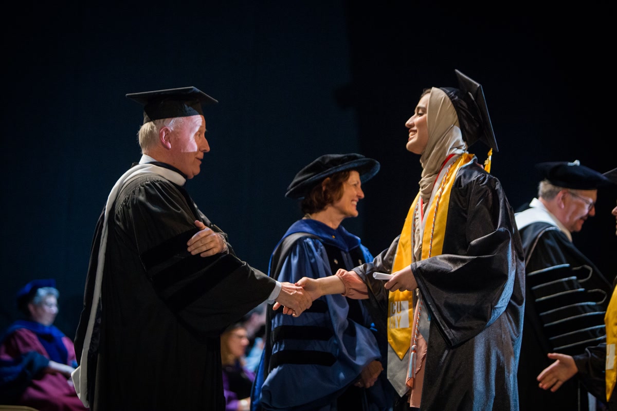 Student shaking hand at 2017 Macaulay commencement