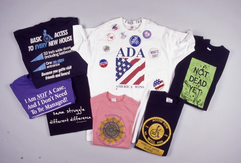 These T-shirts express the energy and humor of the disability rights movement: “Not Dead Yet,” “same struggle, different difference,” “Access Now,” “I am not a case, and I don’t need to be managed.”
